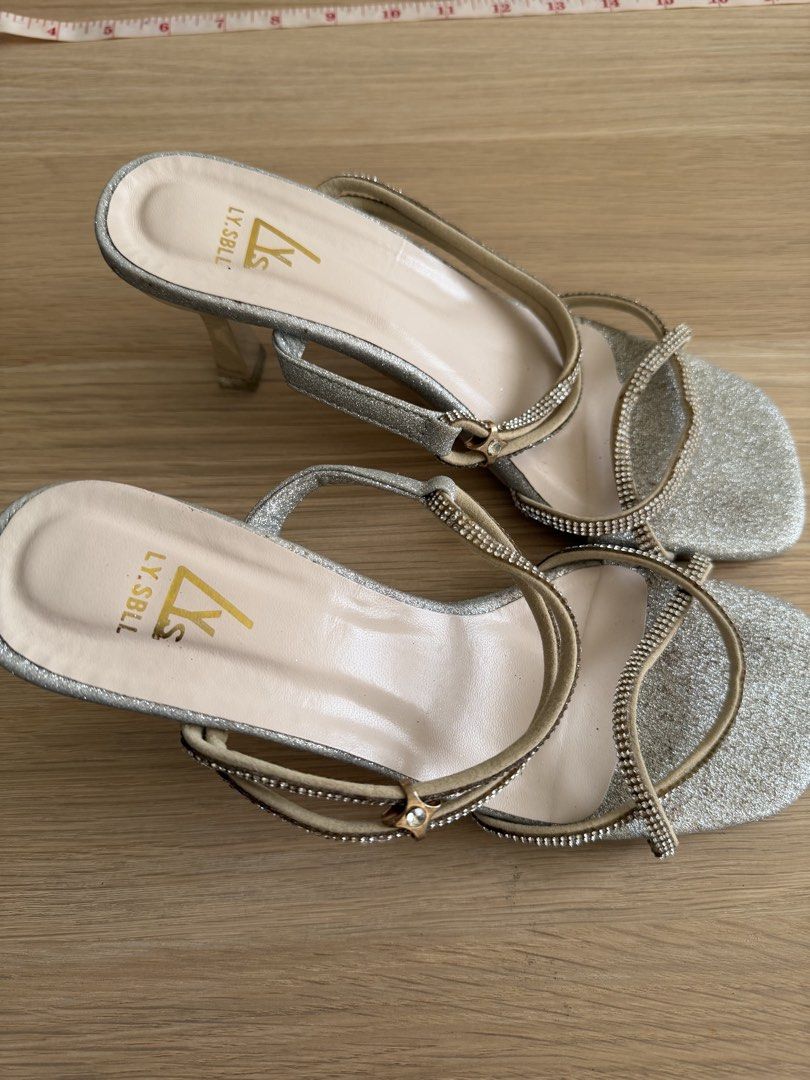 Silver heels (Category: Heels) located in Makati City. Submitted by declutterwithella (Listing ID 1450045034, Image 3). Description: Bought from shoppee for ₱349, used once in a wedding Color: Silver Size: 36 .