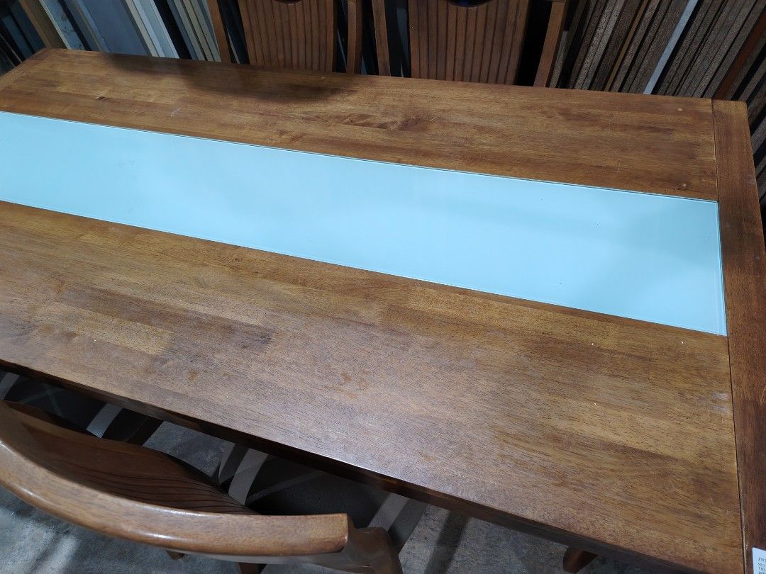 Solid wood dining table set (Category: Tables & Sets) located in Kuala Lumpur. Submitted by srproject (Listing ID 1450050135, Image 3). Description: Solid wood dining table set With 6 solid wood leather chair Table top combine with model glass at the center Rubber wood Table size 6ft x 3ft In Good condition Cash and carry.