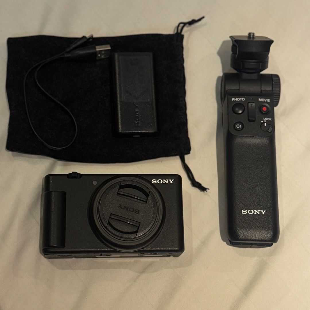 Sony ZV-1F Digital Camera with Grip and Accessories (Category: Cameras) located in Manila. Submitted by preloved_sophia (Listing ID 1450101669, Image 1). Description: Purchased from Sony Store Glorietta - Sony ZV-1 Camera Body - Lens Cap - Black Carrying Pouch - Sony Vlogger Grip (GP-VPT2BT) - Two (2) NP-BX1 Batteries - Battery Charging Cable -64GB Memory Card.