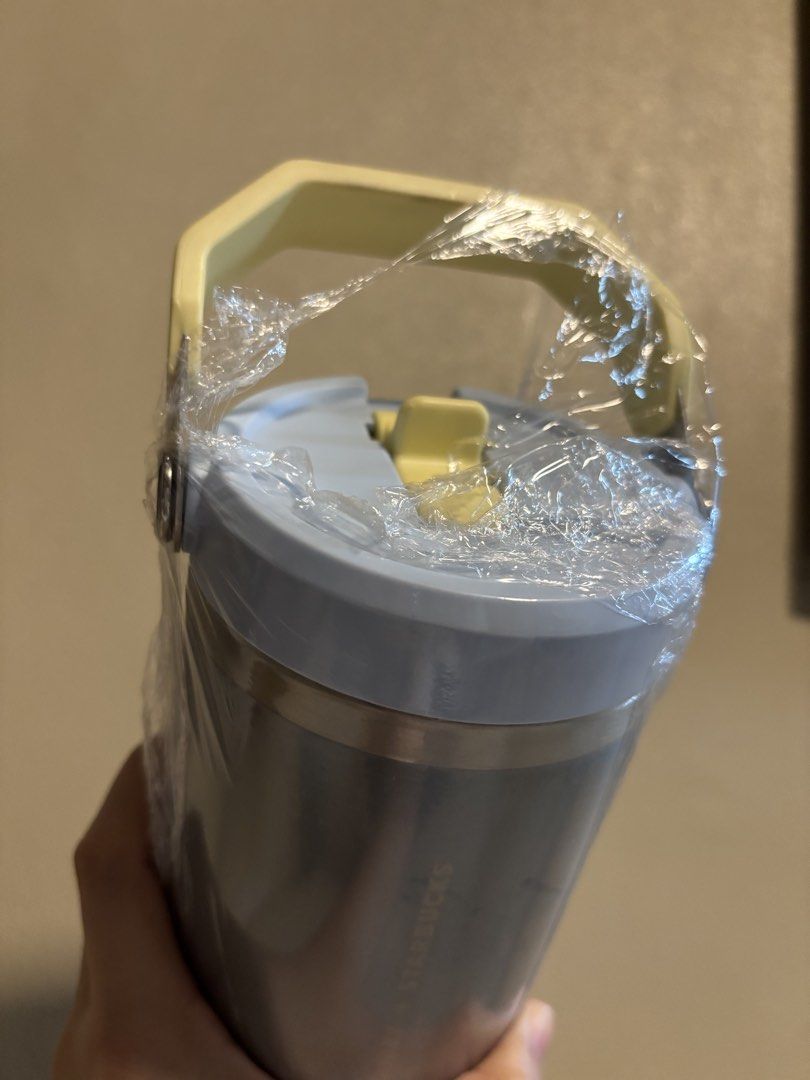 Stanley x Starbucks Tumbler with Handle (Category: Water Bottles & Tumblers) located in Makati City. Submitted by sebastiene (Listing ID 1450001966, Image 2). Description: - Brand new Stanley x Starbucks tumbler - Sleek dark grey/black stainless steel body - Eye-catching light blue lid and yellow handle - Keeps drinks hot or cold for hours - Perfect for travel, work, or everyday use - Still in original plastic packaging.