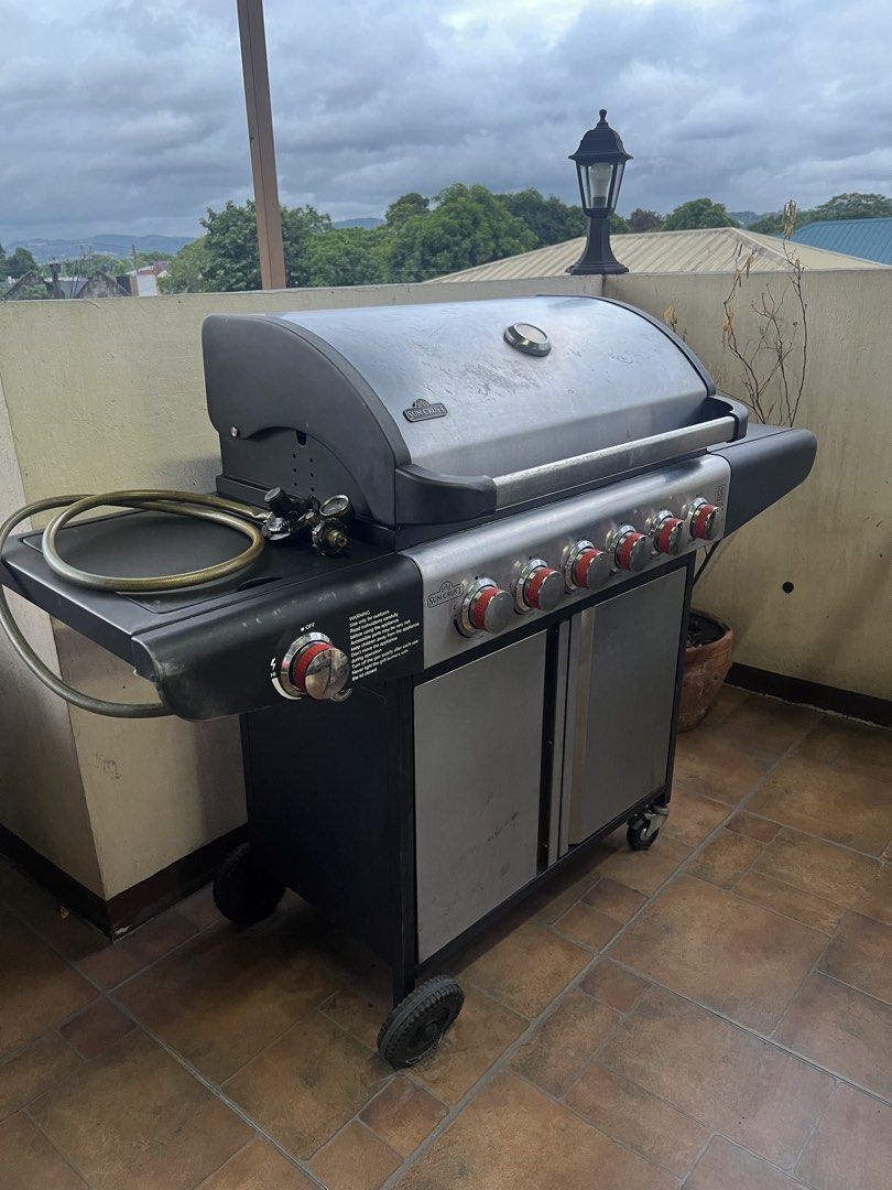 Sun Crust 6-Burner Gas BBQ Grill (Category: BBQ, Grills & Hotpots) located in Cainta. Submitted by xoxo_0924 (Listing ID 1449962912, Image 1). Description: - Powerful 6-burner gas BBQ grill - Ideal for cookouts and family gatherings - Built-in thermometer for temperature monitoring - Spacious double-door cabinet for storage - Sturdy wheels for easy mobility - Convenient side shelves for extra workspace - Durable and reliable construction.