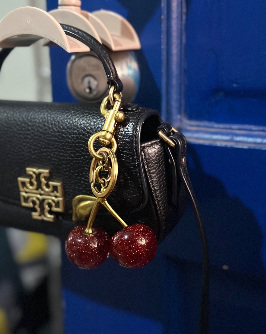 Tory Burch Britten Mini Top Handle (Category: Luxury Bags & Wallets) located in Cebu City. Submitted by isellhere123.543 (Listing ID 1449999034, Image 3). Description: - Cute black Tory Burch mini bag - Made of pebbled leather - Charm not included - Gold hardware - Features a top handle and a long strap - Ideal for carrying essentials - Perfect for nights out or elevating your style.