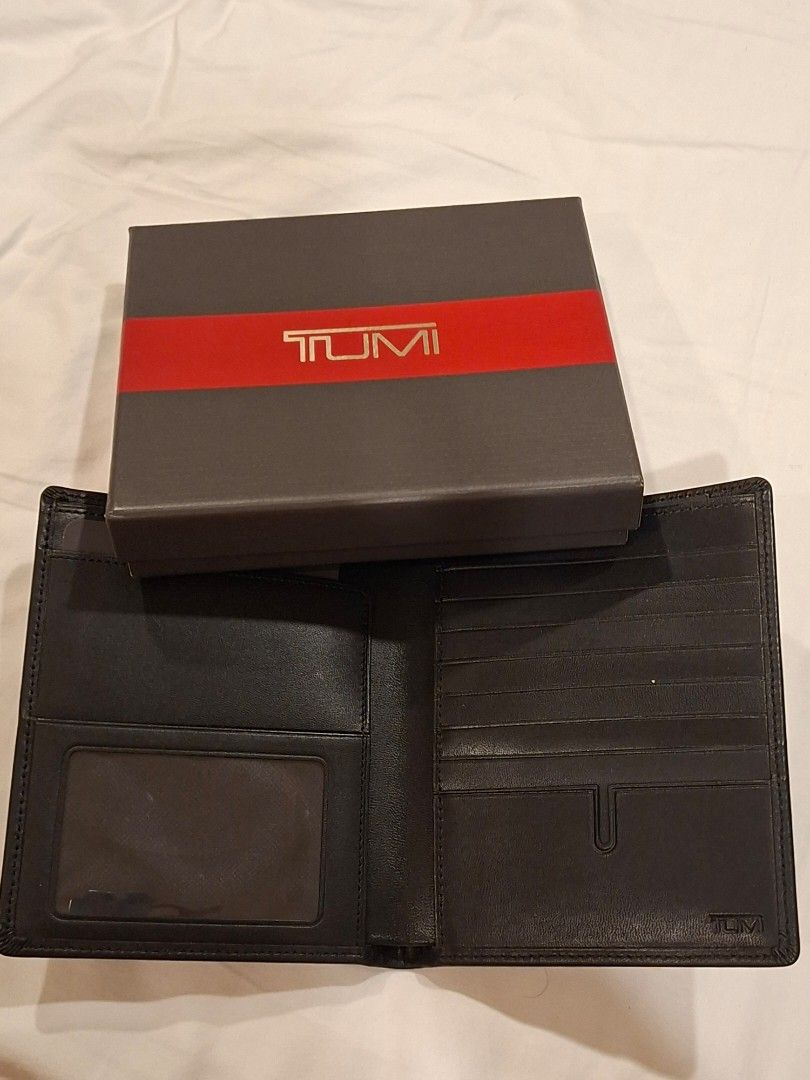 Tumi Alpha Passport Case Wallet Black Leather (Category: Luxury Bags & Wallets) located in Quezon City. Submitted by kytrading (Listing ID 1450131861, Image 2). Description: - Genuine Tumi black leather wallet - Includes original box - Multiple card slots for ample storage - Clear ID window for easy access - Ideal for travel and everyday use - Keeps your essentials neatly organized.