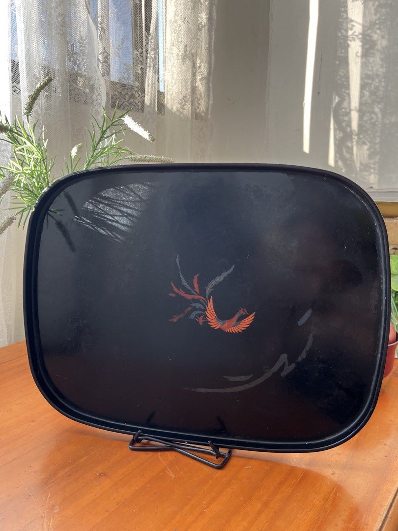 Vintage Black Phoenix Lacquer Serving Tray (Category: Other Kitchenware & Tableware) located in Taguig. Submitted by minmin_parker (Listing ID 1450035848, Image 1). Description: - Black lacquer serving tray - Features a beautiful phoenix design - Approximately 16 inches long - Ideal for serving drinks or snacks - Shows some signs of wear, adding to its vintage charm - Adds a unique vintage touch to your home decor.