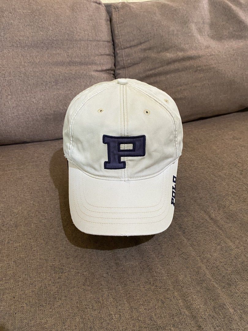 Vintage Polo Ralph Lauren Cap (Category: Caps & Hats) located in Cebu City. Submitted by patspickph (Listing ID 1450000469, Image 2). Description: This is a vintage Polo Ralph Lauren baseball cap featuring a distinctive chenille "P" logo. *Style: Known as a vintage 90s "Big P" or university-style cap. *Design Details: Features a prominent chenille "P" on the front and "POLO" text embroidered on the side of the brim. The wear of this cap is truly 