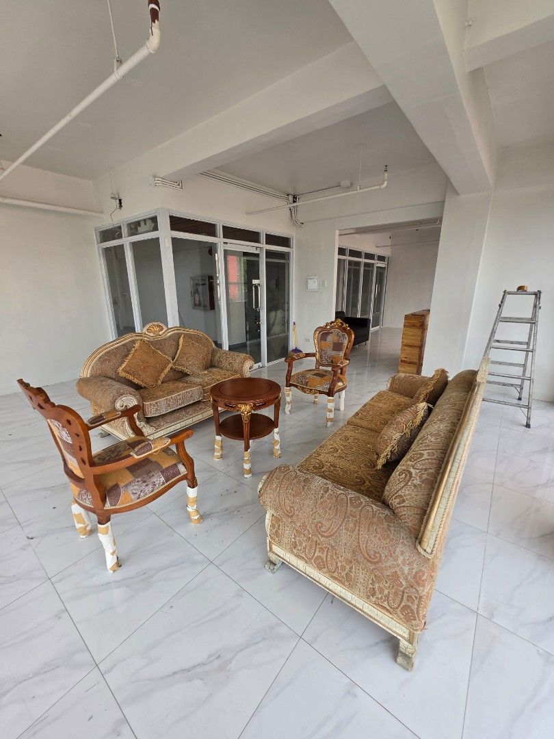 Vintage Style Sofa Set with Chairs and Coffee Table (Category: Sofas) located in Las Pinas. Submitted by nbdg06 (Listing ID 1450028421, Image 2). Description: - Vintage-style sofa set - Includes: 1x 3-seater sofa, 1x 2-seater sofa,2x armchairs, 1 x coffee table - Comes with a small round coffee table - Upholstered in patterned fabric - Features ornate wooden trim - Cushions are included - Ideal for living room or lounge area - Needs a new home!.