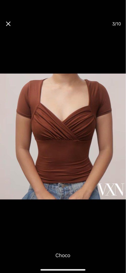 VXN Choco Brown Sweetheart Neckline Ruched Top (Category: Blouses) located in Quezon City. Submitted by shaexlli (Listing ID 1450131448, Image 1). Description: - Brown sweetheart neckline top - Features ruched detailing - Short sleeves - Stretchy material for a comfortable fit - Estimated size S or M - Perfect for dressing up or down - Pairs well with jeans or skirts.