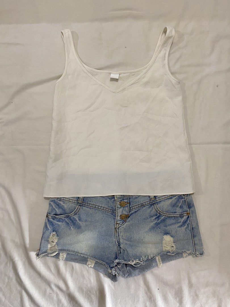 White Tank Top & Distressed Denim Shorts Set (Category: Sets or Coordinates) located in General Santos City (Dadiangas). Submitted by amae.threads_0117 (Listing ID 1450087585, Image 1). Description: - White ribbed V-neck tank top - Light wash denim shorts with distressed rips and frayed hem - Button fly closure - Ideal for warm weather and casual wear - Versatile pieces for easy styling.