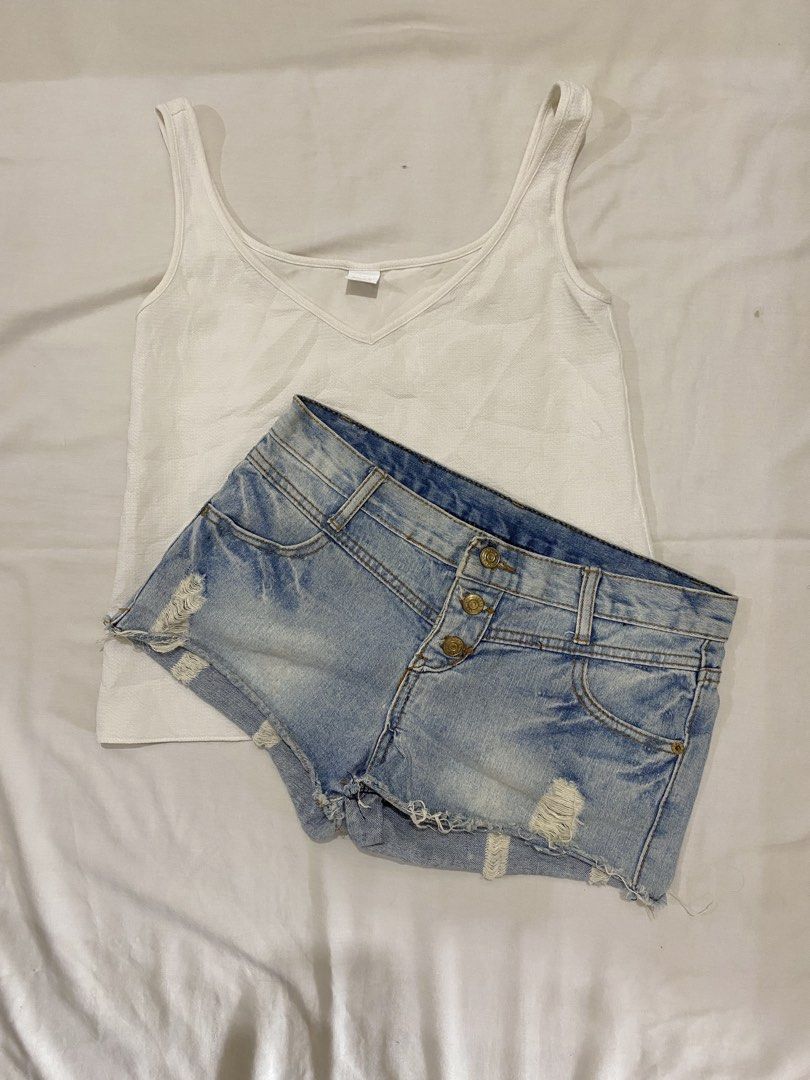 White Tank Top & Distressed Denim Shorts Set (Category: Sets or Coordinates) located in General Santos City (Dadiangas). Submitted by amae.threads_0117 (Listing ID 1450087585, Image 2). Description: - White ribbed V-neck tank top - Light wash denim shorts with distressed rips and frayed hem - Button fly closure - Ideal for warm weather and casual wear - Versatile pieces for easy styling.