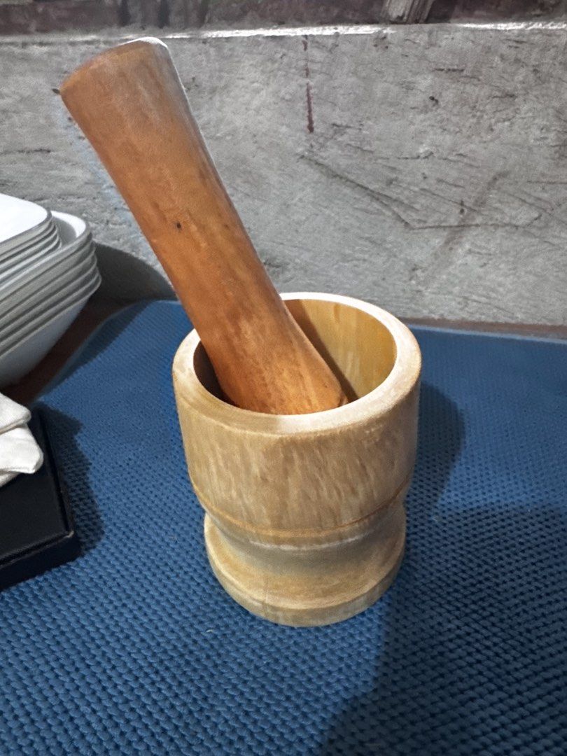 Wooden Mortar and Pestle Set (Category: Other Kitchenware & Tableware) located in Cainta. Submitted by casaesguerra (Listing ID 1450036281, Image 1). Description: - Solid wood construction for durability. - Ideal for grinding spices, herbs, and other ingredients. - Features a beautiful, natural wood grain. - Pestle fits snugly for efficient grinding. - Easy to clean and store. - A timeless and essential kitchen tool..