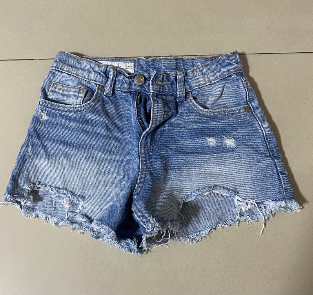 Zara Kids Denim Shorts Size 9 (Category: Babies & Kids Fashion) located in Makati City. Submitted by sebastiene (Listing ID 1450002889, Image 1). Description: - Zara light wash denim shorts - Distressed details and frayed hem - Adjustable waistband inside - Ideal for casual wear and summer days.