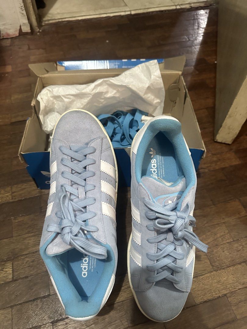 Adidas Campus Light Blue Suede Sneakers (Category: Sneakers) located in Las Pinas. Submitted by inb.l (Listing ID 1450228586, Image 1). Description: Adidas Campus 00s suede material, light blue. size US 11 used 3-4 times only. still very good condition comes with alternate shoe laces issues: very slight chipping of suede - Classic light blue Adidas Campus sneakers - Suede material with iconic white stripes - Comes with original box - Includes ext