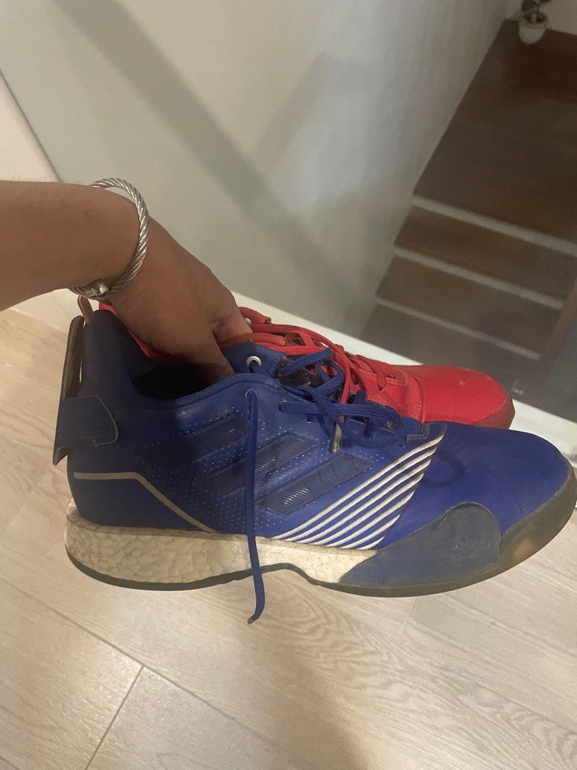 Adidas TMAC Vol all star edition (Category: Sneakers) located in Angeles City. Submitted by lukemafinds (Listing ID 1450287494, Image 1). Description: - Adidas Tmac Allstar edition - Unique mismatched colors: one red shoe, one blue shoe - Equipped with responsive Boost cushioning for comfort and performance - Visible scuffing and wear on soles and uppers, consistent with use - Perfect for playing on the court or adding to a sneaker collection -si