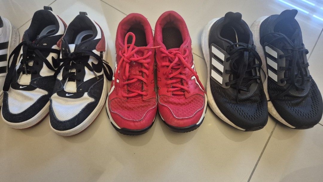 Adidas, Nike, Asics Sneakers Bundle (Category: Sneakers) located in Quezon City. Submitted by chachu89 (Listing ID 1450165063, Image 3). Description: - Bundle includes 4 pairs of sneakers: white Adidas, combination black red white Nike, and red Asics. - All are athletic shoes, perfect for running or casual wear. - Selling as bundle SIZE: NIKE US 4.5 ASICS US 5 ADIDAS BLACK US 5 ADIDAS WHITE US 4.5 ALL ARE WELL USED TAKE ALL FOR 3K THIS WAS USED B