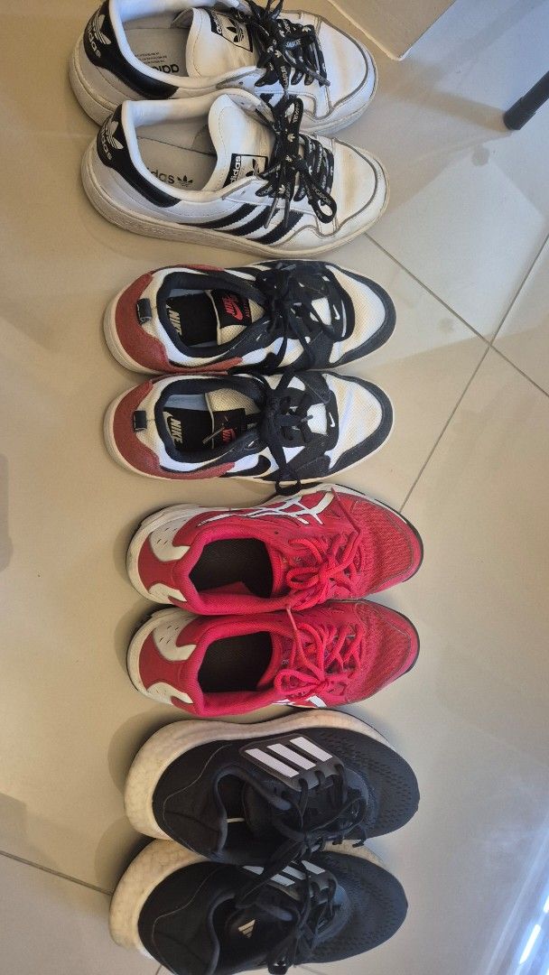 Adidas, Nike, Asics Sneakers Bundle (Category: Sneakers) located in Quezon City. Submitted by chachu89 (Listing ID 1450165063, Image 1). Description: - Bundle includes 4 pairs of sneakers: white Adidas, combination black red white Nike, and red Asics. - All are athletic shoes, perfect for running or casual wear. - Selling as bundle SIZE: NIKE US 4.5 ASICS US 5 ADIDAS BLACK US 5 ADIDAS WHITE US 4.5 ALL ARE WELL USED TAKE ALL FOR 3K THIS WAS USED B