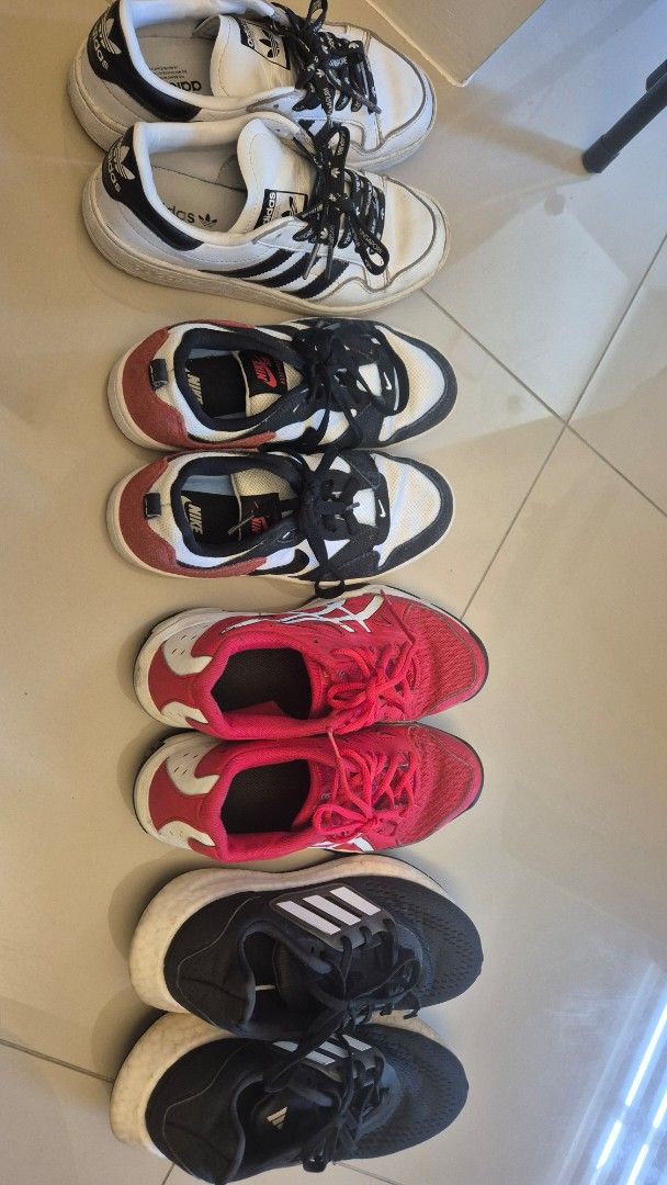 Adidas, Nike, Asics Sneakers Bundle (Category: Sneakers) located in Quezon City. Submitted by chachu89 (Listing ID 1450165063, Image 2). Description: - Bundle includes 4 pairs of sneakers: white Adidas, combination black red white Nike, and red Asics. - All are athletic shoes, perfect for running or casual wear. - Selling as bundle SIZE: NIKE US 4.5 ASICS US 5 ADIDAS BLACK US 5 ADIDAS WHITE US 4.5 ALL ARE WELL USED TAKE ALL FOR 3K THIS WAS USED B