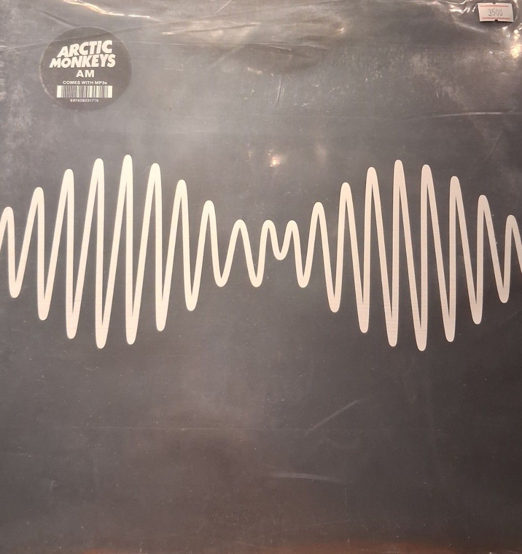 Arctic Monkeys AM Vinyl Record (Category: Vinyls) located in Quezon City. Submitted by pooh_laa (Listing ID 1450205118, Image 1). Description: - Arctic Monkeys AM vinyl record - Features iconic waveform design - Essential for any music collection.