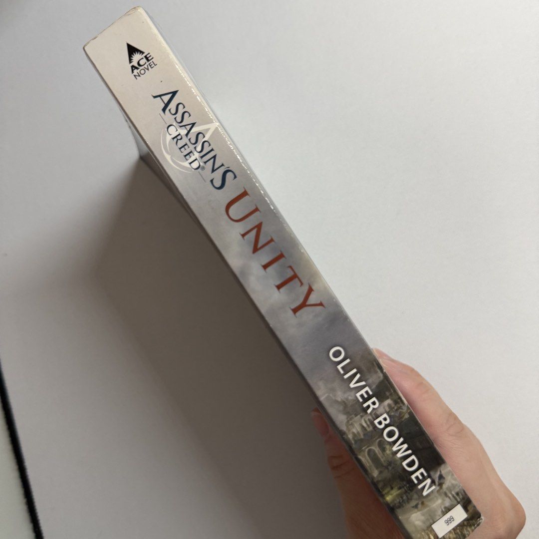 Assassin’s Creed Unity by Oliver Bowden (Category: Storybooks) located in Manila. Submitted by hunchbunch (Listing ID 1450242815, Image 3). Description: - Slight browning - No marks - Original price: 399 - Original novel based on the video game from Ubisoft - Message for more photos - RFS: Decluttering.