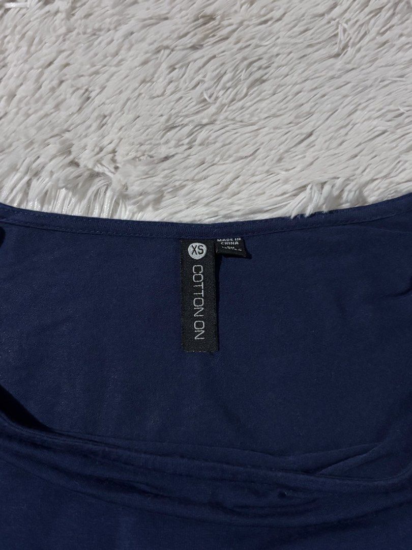 Authentic Cotton On Dark Blue Wide Neck Stretchable Top (Category: Blouses) located in Bulacan. Submitted by rin2024 (Listing ID 1450269554, Image 3). Description: Authentic Cotton On Dark Blue Wide Neck Stretchable Top - Highly stretchable, with body hugging fit - Mid-length sleeves Payment Method: GCash only. Delivery Options: Lalamove, Grab, or J&T only, with shipping fee shouldered by buyer..