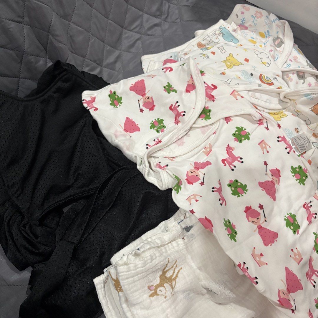 Baby Carrier & Swaddle set (Category: Babies & Kids Fashion) located in Marikina City. Submitted by marjpc (Listing ID 1450225458, Image 2). Description: - Bundle includes 3 adorable baby swaddles with cute prints (princesses, frogs, animals). - Also includes a black mesh carrier, size M. -Muslin blanket - Perfect for keeping your baby cozy and secure. - All items are clean and ready for a new home. Selling as a bundle for 390 only NO reservation
