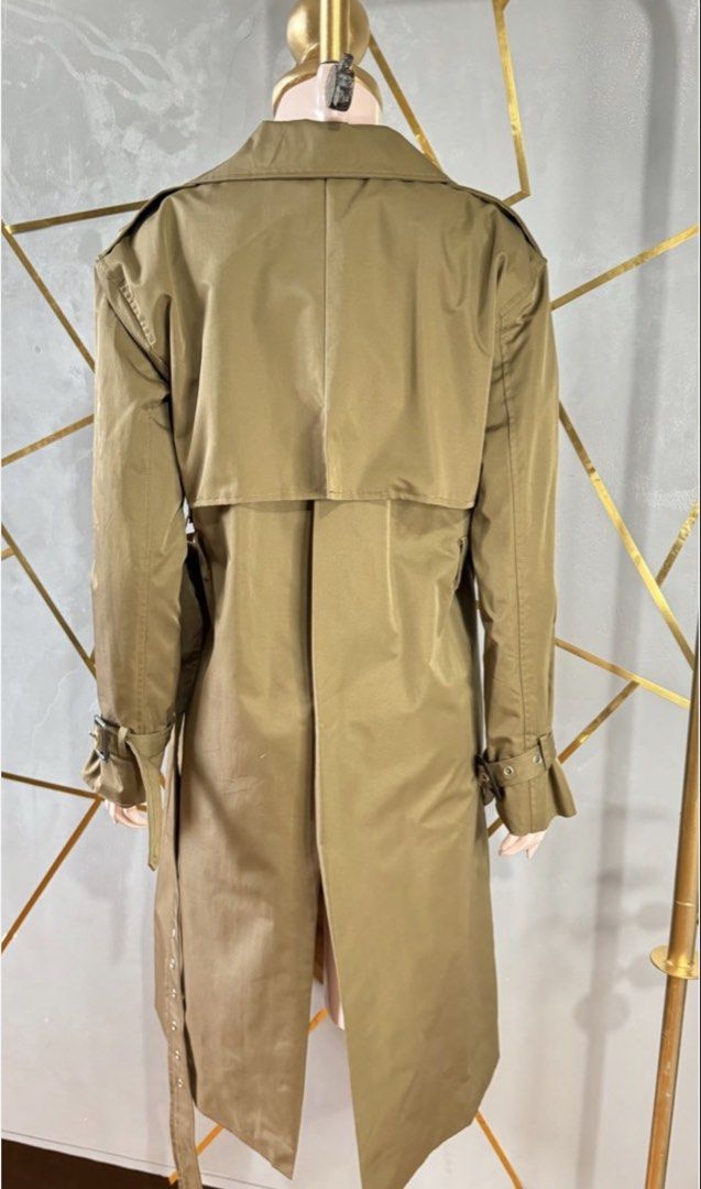 Balenciaga Paris Double Breasted Trench Coat (Category: Coats, Jackets and Outerwear) located in Las Pinas. Submitted by CocoBebeBeautiQ (Listing ID 1450158649, Image 2). Description: - Classic Balenciaga trench coat - Olive green color - Double-breasted design - Belted waist for adjustable fit - Made in Italy - Timeless and versatile piece - Perfect for layering.