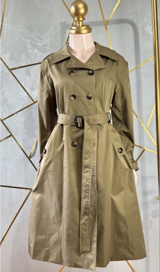 Balenciaga Paris Double Breasted Trench Coat (Category: Coats, Jackets and Outerwear) located in Las Pinas. Submitted by CocoBebeBeautiQ (Listing ID 1450158649, Image 1). Description: - Classic Balenciaga trench coat - Olive green color - Double-breasted design - Belted waist for adjustable fit - Made in Italy - Timeless and versatile piece - Perfect for layering.