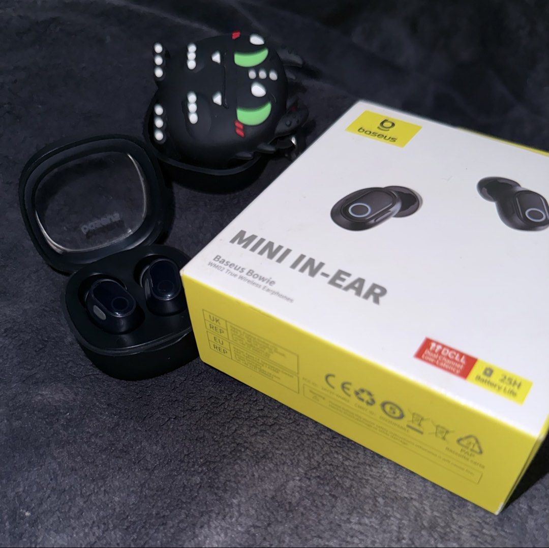 Baseus Bowie Mini In-Ear Wireless Earbuds with Case (Category: Earphones) located in Muntinlupa City. Submitted by han2far (Listing ID 1450273106, Image 3). Description: - Baseus Bowie Mini In-Ear Wireless Earbuds - Color: Black - Includes charging case - Comes with a cute monster-themed silicone case cover - Battery life: Up to 25 hours - Features low latency for seamless audio experience.