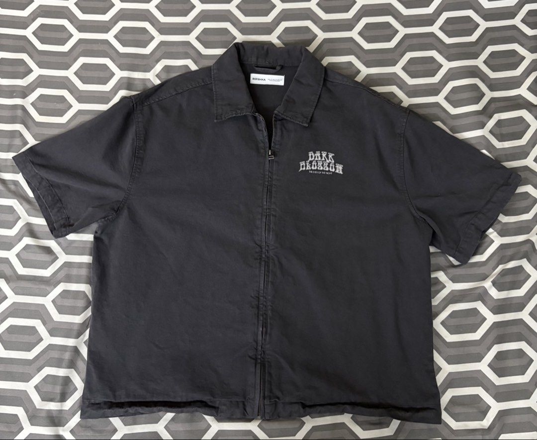 Bershka Dark Blossom Zip Up Jacket (Category: Tshirts & Polo Shirts ) located in Manila. Submitted by markrobles54253 (Listing ID 1450212969, Image 1). Description: - used once - m on tag but fits large - Bershka grey zip-up jacket - Features 'Dark Blossom The Eyes of the Night' chest graphic - Short sleeves - Collared design - Perfect for layering or as a light jacket - Please check photos for condition details.