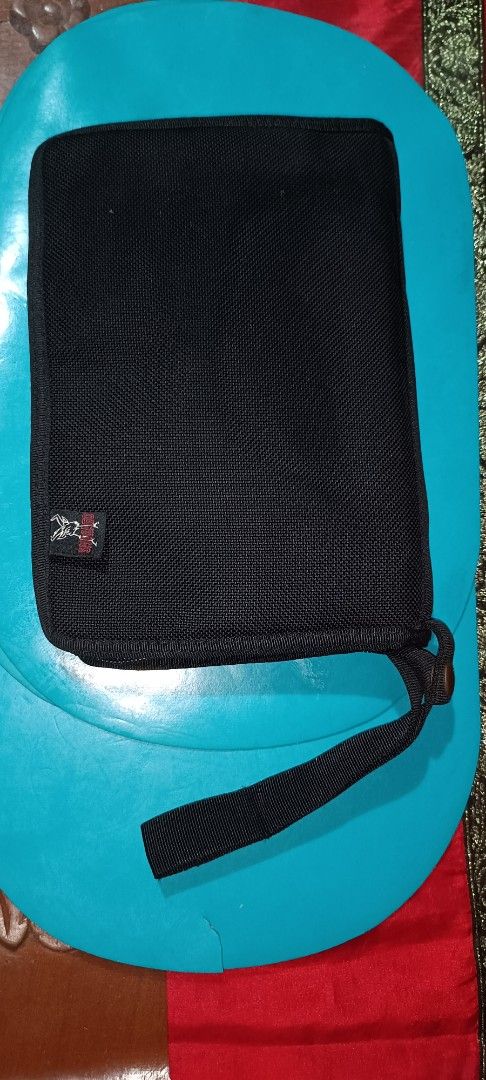 Black clutchbag gun safety case (Category: Combat Sports) located in Muntinlupa City. Submitted by k2508 (Listing ID 1450136291, Image 1). Description: - Black clutchbag gun safety case, made of strong canvass - Multiple compartments inside - Slots for cards and small items - Zipper closure - Includes a wrist strap - Ideal for keeping essentials tidy - size: (length x width x thickness) 24cm x 17cm x 4cm, can fit and ideal for cal. 9mm, cal.45mm(
