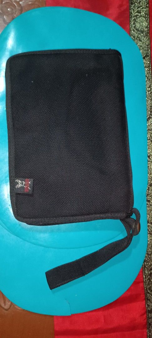 Black clutchbag gun safety case (Category: Combat Sports) located in Muntinlupa City. Submitted by k2508 (Listing ID 1450136291, Image 2). Description: - Black clutchbag gun safety case, made of strong canvass - Multiple compartments inside - Slots for cards and small items - Zipper closure - Includes a wrist strap - Ideal for keeping essentials tidy - size: (length x width x thickness) 24cm x 17cm x 4cm, can fit and ideal for cal. 9mm, cal.45mm(