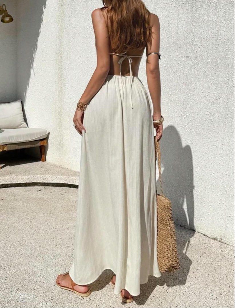 Boho Halter Neck Maxi Dress with Shell Embellishments (Category: Dresses) located in Manila. Submitted by graciouslygraceee (Listing ID 1450242307, Image 2). Description: - Cream/off-white halter neck maxi dress - Deep V-neckline - Smocked waist with shell and bead embellishments - Open back with tie closure - Flowy skirt - Estimated size: XXS - Ideal for beach or vacation wear.