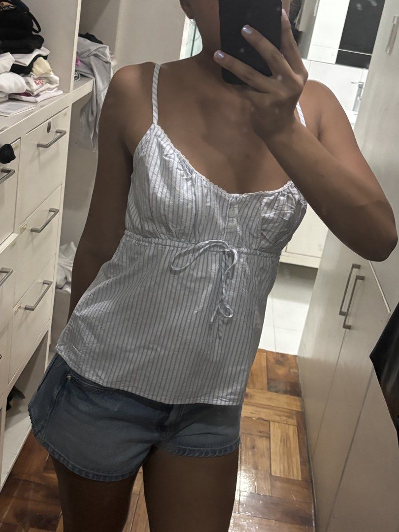 Brandy Melville White Blue Striped Top (Category: Sleeveless) located in Muntinlupa City. Submitted by 4nnika (Listing ID 1450296252, Image 2). Description: - from Brandy Paris with tags, never used - best fits S to M - with adjustable straps and bust area - all pics posted, no addtl pic reqs pls! same day delivery available .