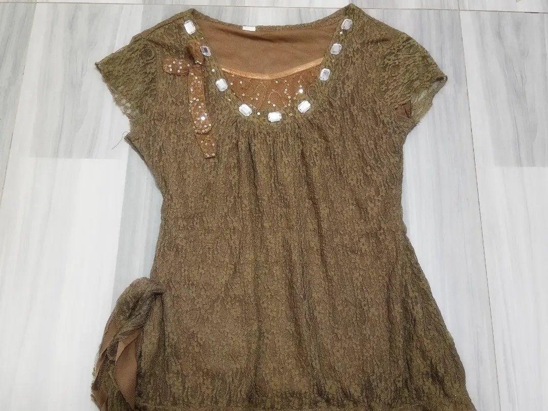 Brown Lace Top with Sequins and Embellishments (Category: Sleeveless) located in Manila. Submitted by lovedbynabix (Listing ID 1450225820, Image 1). Description: Elegant brown lace top with short sleeves, round neck, and sequin/gem embellishments. Features a ribbon bow and hip tie detail. Unique textured fabric, perfect for dressing up..