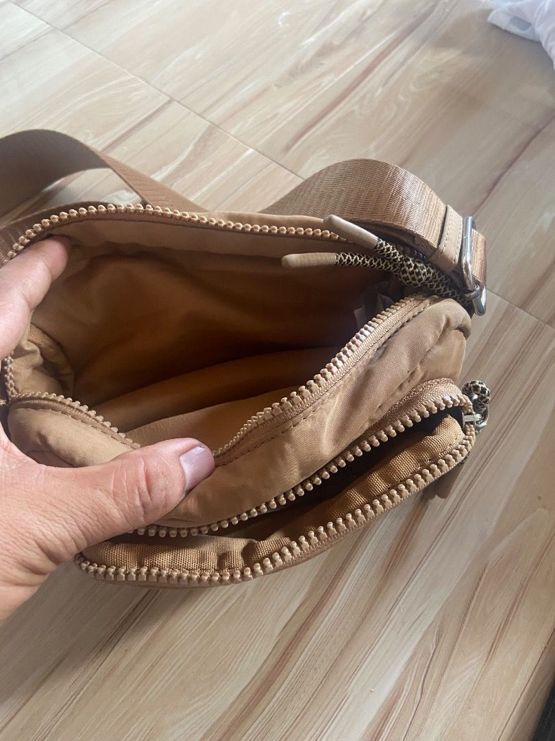 Brown Nylon Crossbody Bag with Adjustable Strap (Category: Cross-body Bags) located in Valenzuela. Submitted by goldencloud_80e012 (Listing ID 1450161375, Image 2). Description: - Brown nylon crossbody bag - Main compartment for storage - Front zip pocket for quick access - Adjustable strap for comfortable wear - Ideal for everyday use and carrying essentials.