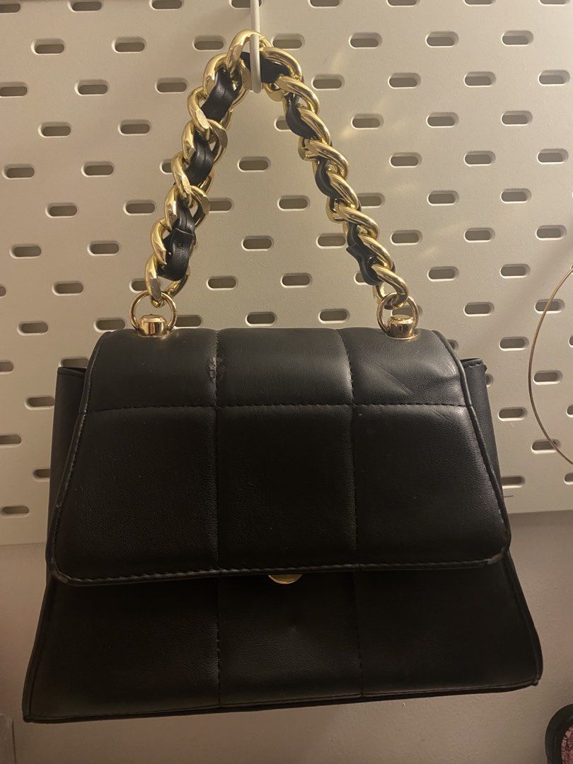 Call it Spring Black Quilted Handbag with Gold Chain Strap (Category: Luxury Bags & Wallets) located in Manila. Submitted by larajaysong (Listing ID 1450258332, Image 1). Description: - Cute black quilted handbag - Chic gold chain strap - Flap closure with small gold clasp - Great for going out or everyday use - Fits essentials - Clean inside and out.