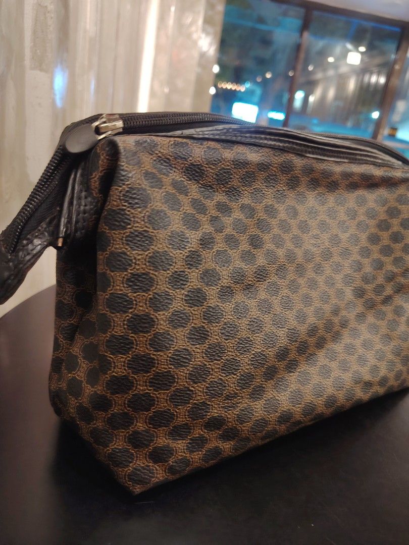 Celine Macadam Cosmetic Pouch Bag (Category: Luxury Bags & Wallets) located in Cagayan de Oro. Submitted by michaelluxuryitems (Listing ID 1450168449, Image 2). Description: - Classic Celine cosmetic pouch - Iconic Macadam print - Zipper closure - Multiple interior compartments for organization - Ideal for travel or everyday use - A timeless accessory.
