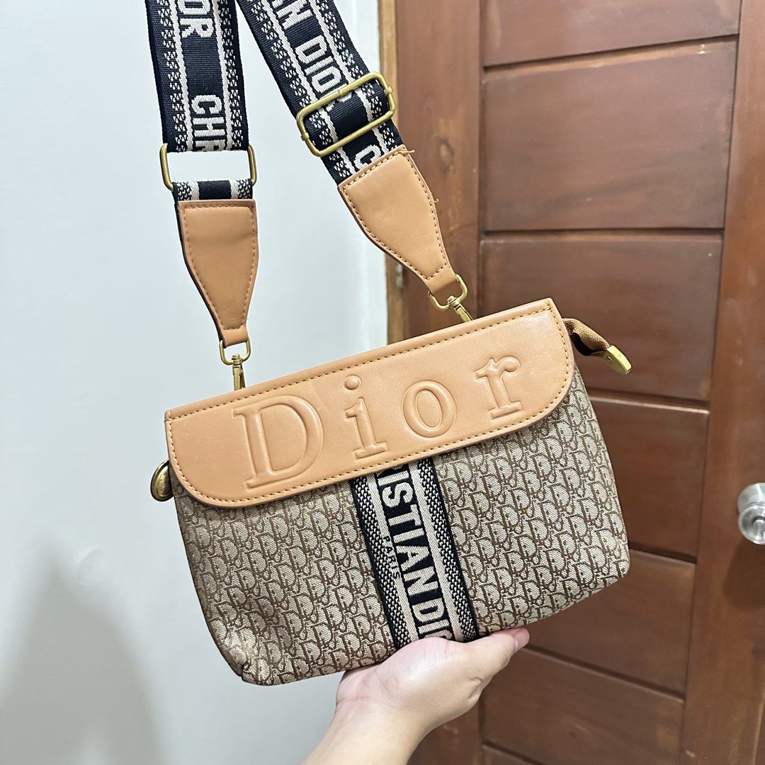 Christian Dior Monogram Shoulder Bag with Adjustable Strap (Category: Luxury Bags & Wallets) located in Lucena. Submitted by zcareia. (Listing ID 1450279805, Image 1). Description: - Classic Dior monogram shoulder bag - All-over iconic Dior pattern - Black and white Christian Dior branded adjustable strap - Multiple interior compartments for organization - Magnetic snap closure on flap - Gold hardware details.