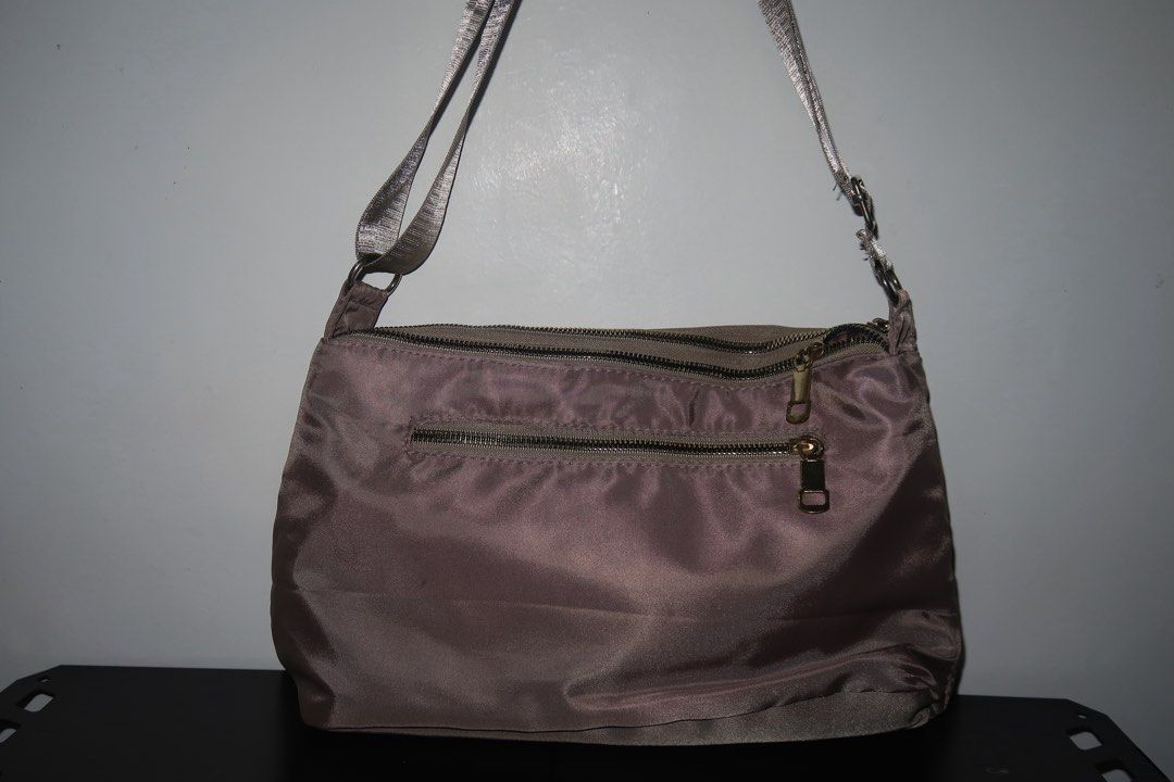Classic Nylon Sling Bag – Brown/Gray (Category: Shoulder Bags) located in Calamba. Submitted by declutter.rebski (Listing ID 1450275099, Image 3). Description: Classic Nylon Sling Bag – Brown/Gray ₱250 A sleek and lightweight nylon sling bag in a versatile brown-gray shade, perfect for everyday use. Designed with a spacious interior, secure zip closure, and comfortable shoulder strap, this bag offers both style and functionality for casual outing