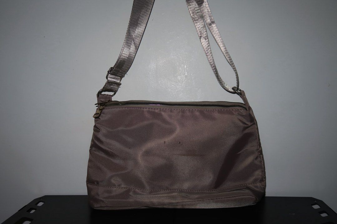 Classic Nylon Sling Bag – Brown/Gray (Category: Shoulder Bags) located in Calamba. Submitted by declutter.rebski (Listing ID 1450275099, Image 2). Description: Classic Nylon Sling Bag – Brown/Gray ₱250 A sleek and lightweight nylon sling bag in a versatile brown-gray shade, perfect for everyday use. Designed with a spacious interior, secure zip closure, and comfortable shoulder strap, this bag offers both style and functionality for casual outing