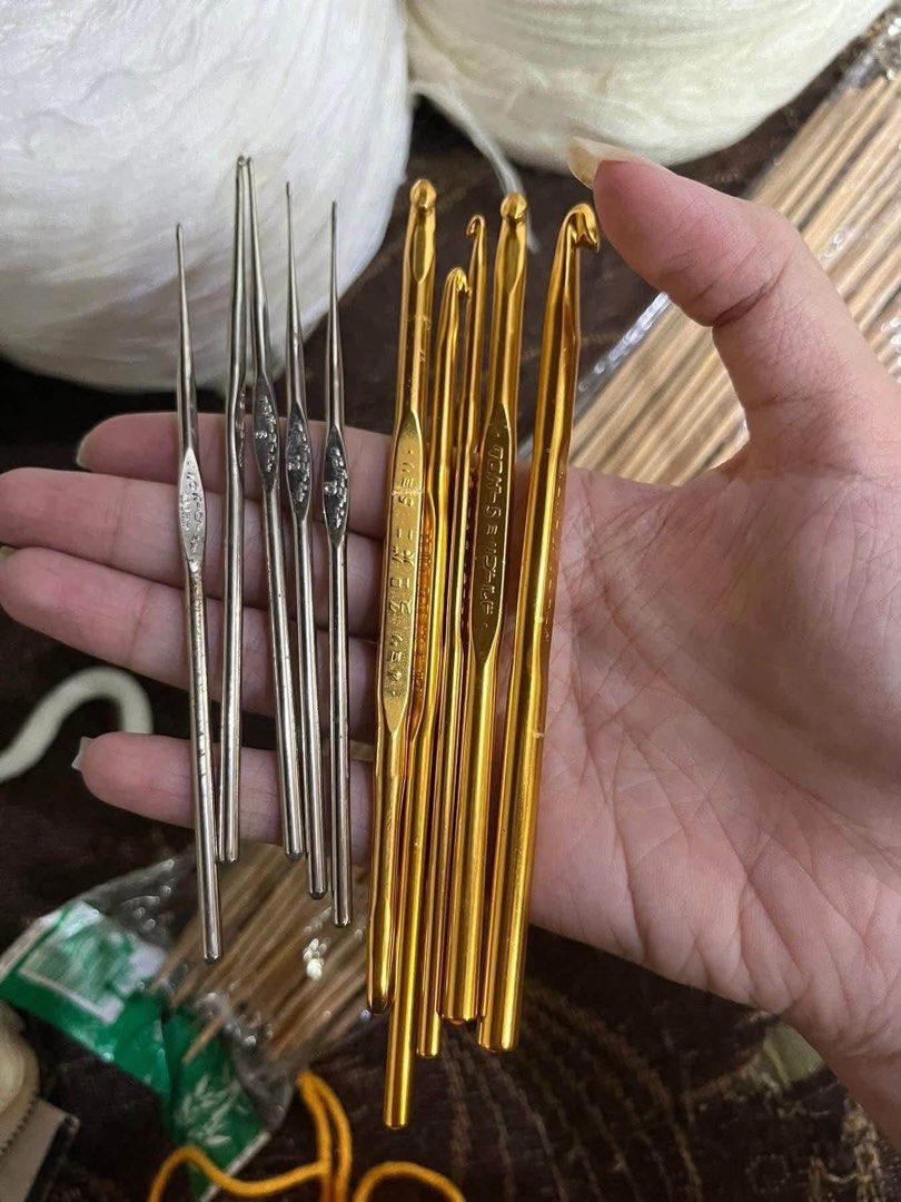 Clover Crochet Hooks Set & Assorted Yarn Balls (Category: Craft Supplies & Tools) located in Manila. Submitted by declutbyal (Listing ID 1450156504, Image 3). Description: - Complete crochet and knitting bundle - Includes Clover brand metal crochet hooks (both gold and silver finishes) - Comes with several balls of yarn in green, purple, white, and orange - Also includes wooden knitting needles - Ideal for starting or expanding your crafting supp