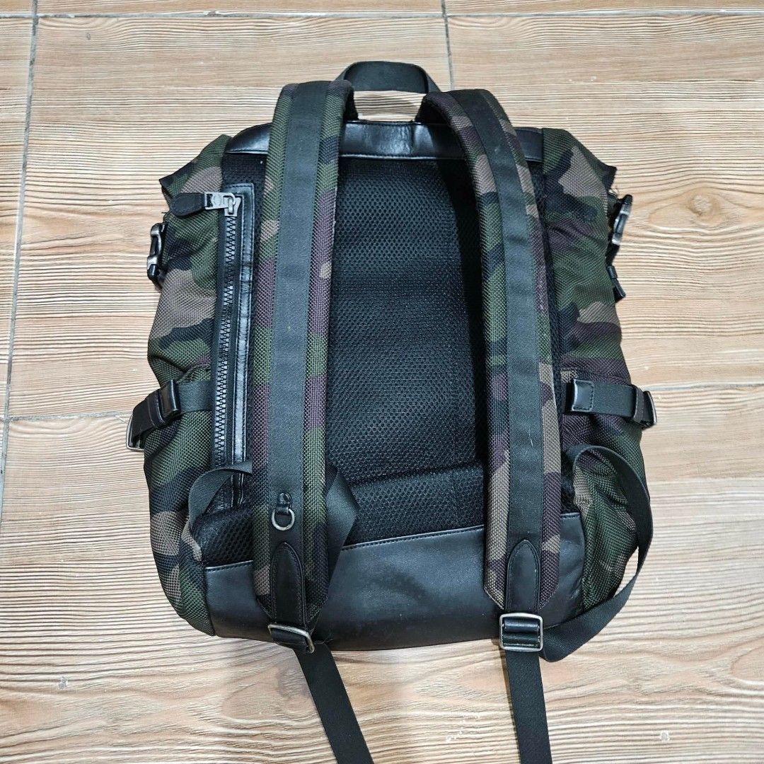 Coach Camouflage Leather Trim Backpack (Category: Backpacks) located in Cavite. Submitted by blarix (Listing ID 1450280444, Image 2). Description: - Stylish Coach backpack with cool camouflage print - Accented with sleek black leather details - Secure roll-top closure for easy access - Multiple pockets designed for excellent organization - Padded back panel and straps ensure maximum comfort - Ideal for everyday adventures or your next travel geta