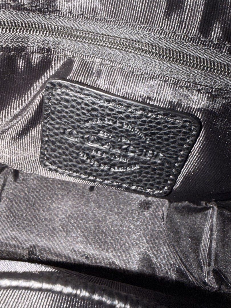 Coach Monogram Crossbody Bag Black Grey (Category: Luxury Bags & Wallets) located in Cebu City. Submitted by ivanprince23. (Listing ID 1450270665, Image 3). Description: - Authentic Coach crossbody bag - Signature monogram print in black and grey - Textured leather flap with buckle detail - Secure zipper closure on top - Branded leather tag inside - Ample interior space for essentials - Adjustable strap for comfortable wear.