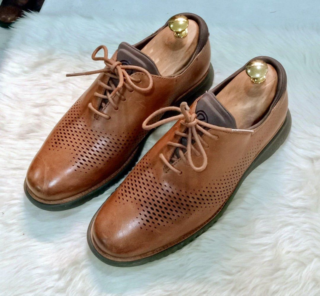 Cole Haan 2.zerogrand Laser Wingtip Oxford in British Tan Java Sz 7W (Category: Casual Shoes) located in Paranaque City. Submitted by sole2squeeze (Listing ID 1449741682, Image 1). Description: - Brand: Cole Haan - Color: British Tan Java - Style: Leather Oxford Shoes - Features: Perforated toe box design, Lace-up closure - Sole: Comfortable Grand.OS sole - Excludes Shoe trees - Occasion: Ideal for smart casual wear - Size 7W.