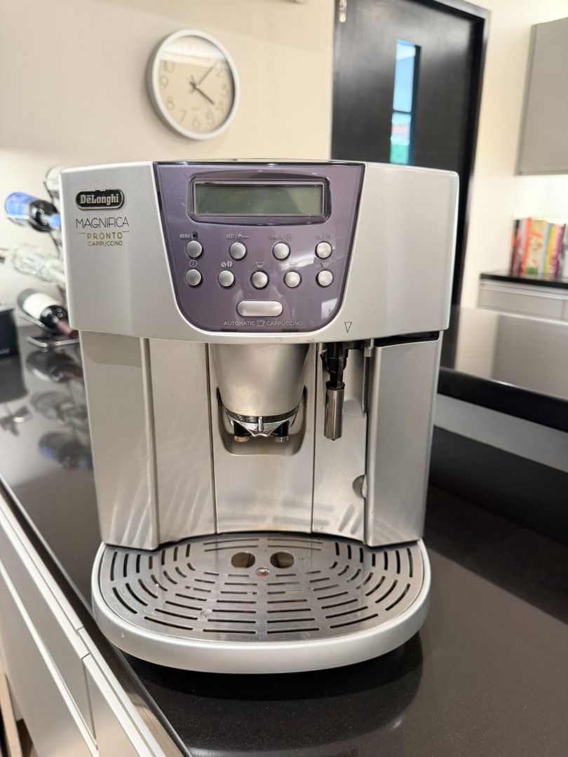 DeLonghi Magnifica Pronto Cappuccino Automatic Coffee Machine (Category: Coffee Machines & Makers) located in Quezon City. Submitted by sheilaupl38311 (Listing ID 1450163060, Image 1). Description: - DeLonghi Magnifica Pronto Cappuccino automatic coffee machine - Makes great coffee - Easy to use with automatic cappuccino function - Drip tray and internal parts are visible - comes with milk pitcher and manual.
