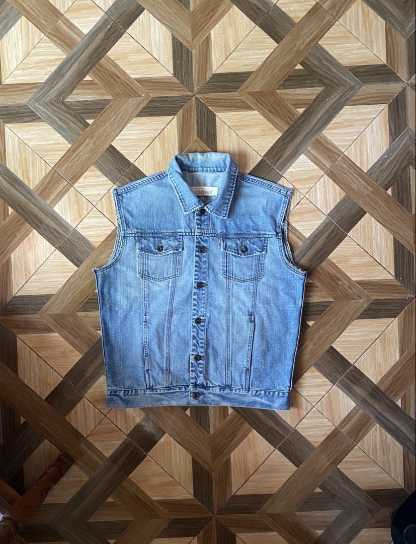 Denim Vest (Category: Vests) located in Puerto Princesa. Submitted by streetnfinds (Listing ID 1450256115, Image 1). Description: Length: 26" Width: 23" Large - Classic light wash denim vest by Levi's - Sleeveless design - Button-up front closure - Two chest pockets with button closures - Includes side pockets - Ideal for layering and versatile styling.