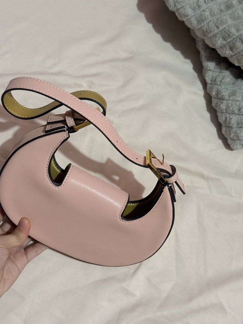 Fendi Pink Monogram Mini Baguette Shoulder Bag (Category: Luxury Bags & Wallets) located in Manila. Submitted by tuchiichi (Listing ID 1450257955, Image 2). Description: - Super cute Fendi mini bag - Pink leather with gold hardware - Iconic FF logo on front flap - Fendi Roma branding inside - Adjustable strap - Perfect for night out or everyday use - can do lalamove - gcash payment or gotyme.
