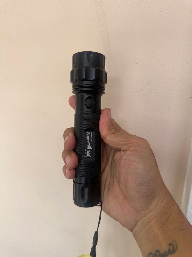 Gentos Superfire XX flashlight (Category: Hiking & Camping) located in Rodriguez. Submitted by pwestoonlinestore (Listing ID 1450158279, Image 1). Description: Tested working Battery operated (2pcs C cell battery) mataba sya sa AA. This Gentos SuperFire XX SF-332XX flashlight is a durable metal model with a textured grip and a wrist lanyard.It typically operates on two C-size alkaline batteries.The flashlight features a sliding head for adjusting