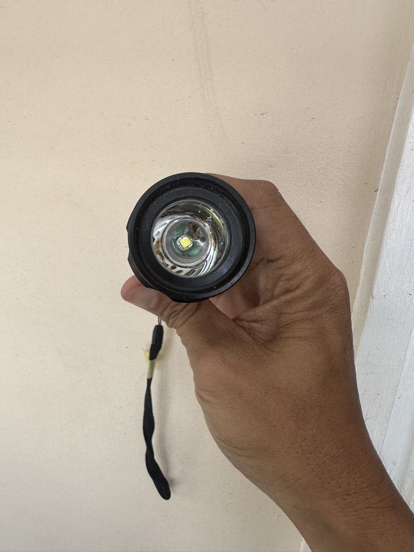 Gentos Superfire XX flashlight (Category: Hiking & Camping) located in Rodriguez. Submitted by pwestoonlinestore (Listing ID 1450158279, Image 2). Description: Tested working Battery operated (2pcs C cell battery) mataba sya sa AA. This Gentos SuperFire XX SF-332XX flashlight is a durable metal model with a textured grip and a wrist lanyard.It typically operates on two C-size alkaline batteries.The flashlight features a sliding head for adjusting