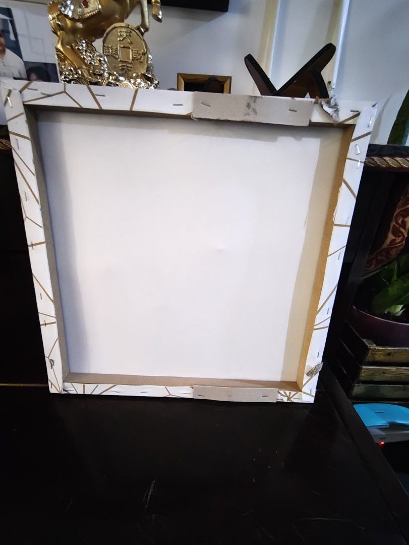 Geometric Gold Line Art Canvas Wall Decor (Category: Wall Decor) located in Caloocan City. Submitted by daj2k-25333 (Listing ID 1450178918, Image 2). Description: - Modern art canvas featuring a white background with a striking gold geometric pattern. - Dimensions: Approximately 40cm x 40cm. - Stretched over a sturdy wooden frame, making it ready to hang immediately. - Perfect for adding a touch of contemporary elegance and shine to your living s