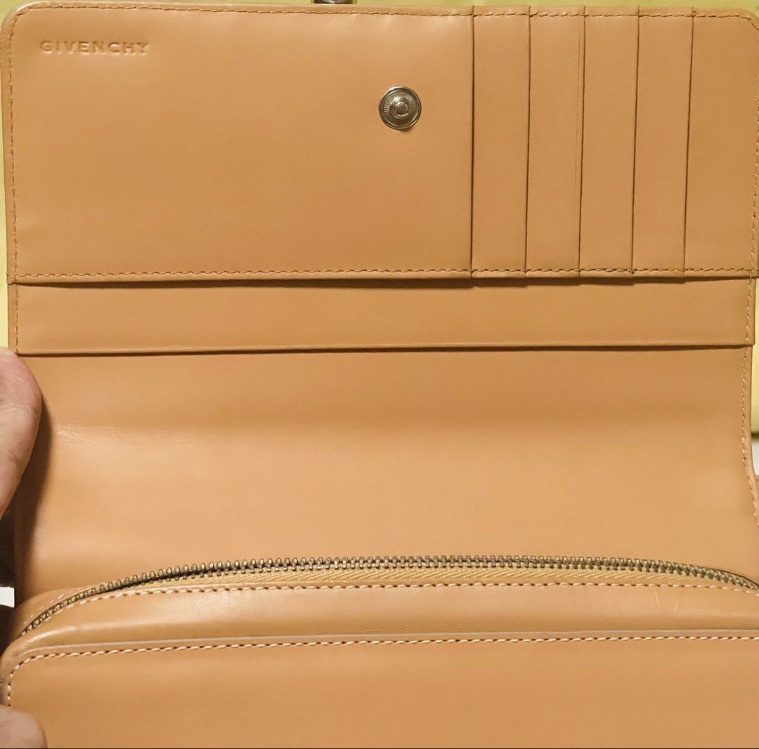 Givenchy 4G Leather Shoulder bag/Clutch Tan (Category: Luxury Bags & Wallets) located in Manila. Submitted by ermenchita71969 (Listing ID 1450295739, Image 3). Description: - Authentic Givenchy tan leather wallet - Features embossed Givenchy logo on the front - Ample card slots for organization - Zippered compartment for coins or small essentials - Adjustable strap for convenience - Versatile for everyday use or a night out - With Certificate of 
